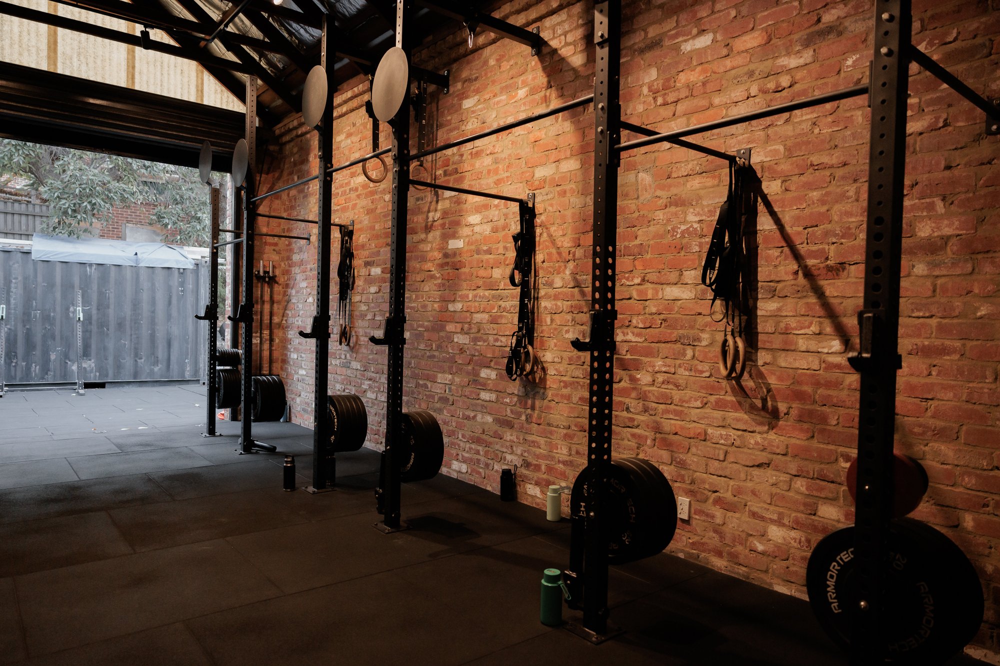 Group training rig along the studio's brick wall